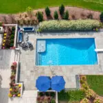 Overhead of inground swimming pool with bubblers and diving board.